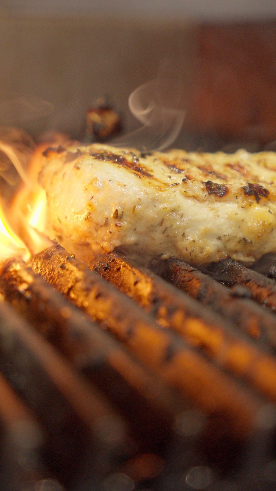 Chicken on grill — flame shot